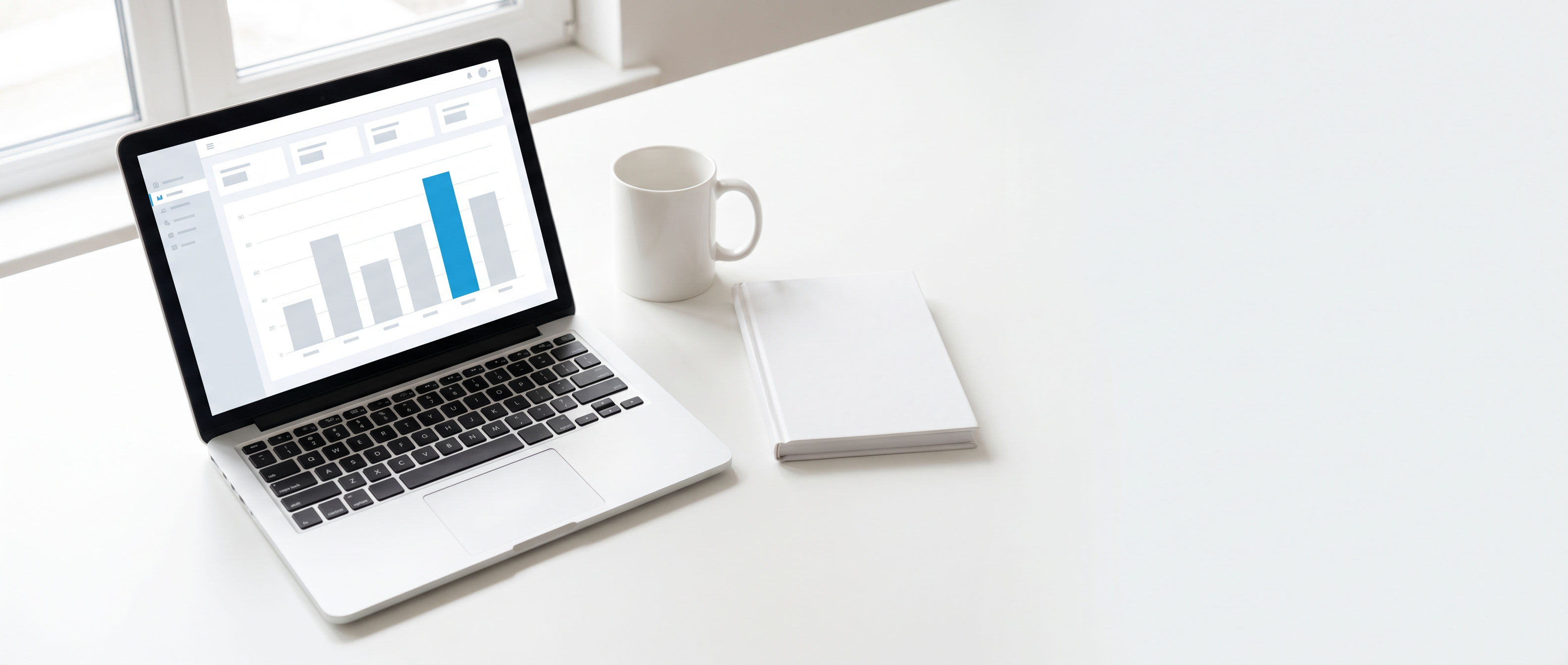 Laptop on a clean desk showing a simple dashboard with one azure bar