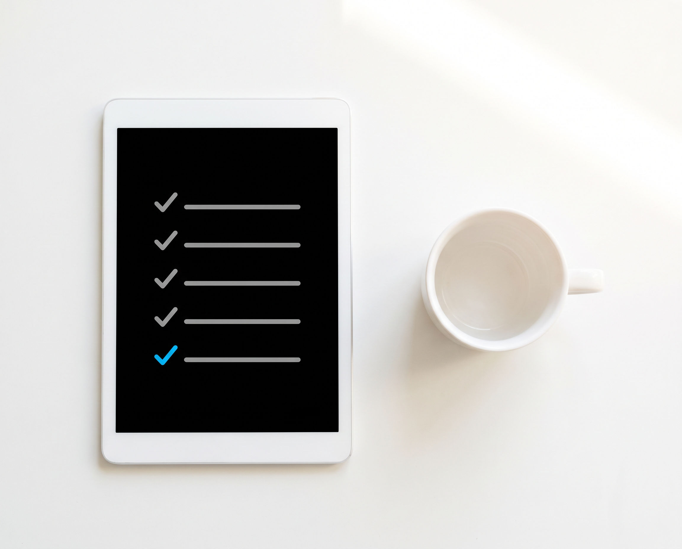 Tablet showing a checklist with one azure checkmark