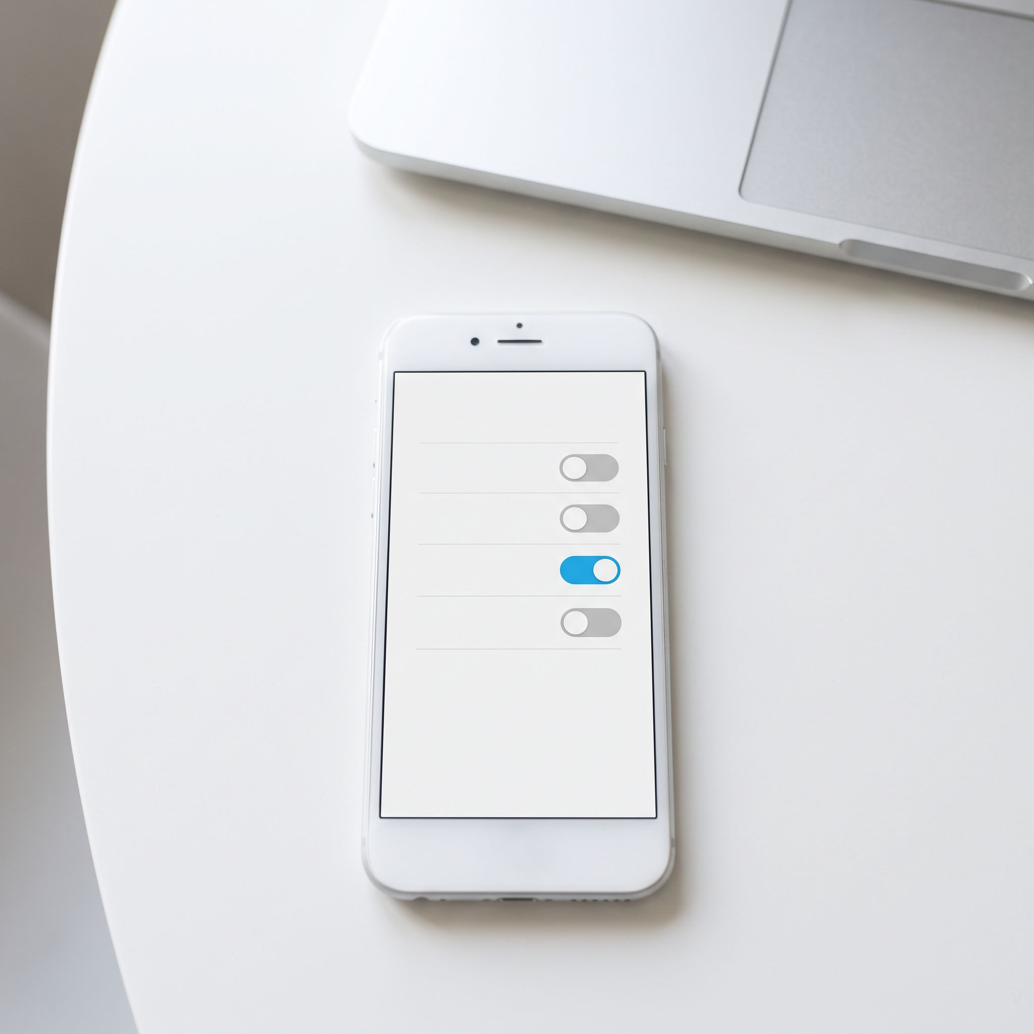 Smartphone with four toggle switches, one azure and on